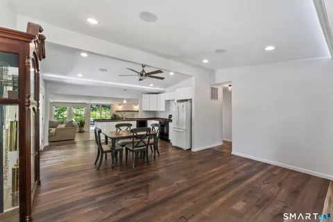 a view of a dining room with furniture and a table