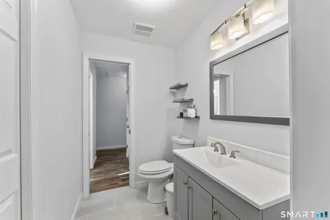 a bathroom with a shower and a sink
