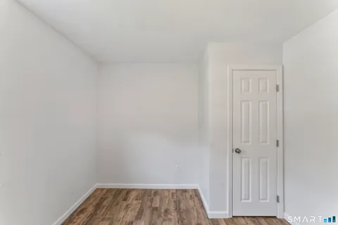 a bedroom with bed and a window