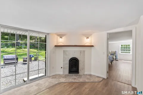 a view of livingroom with furniture and floor to ceiling window