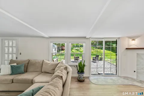 a living room with furniture and a window