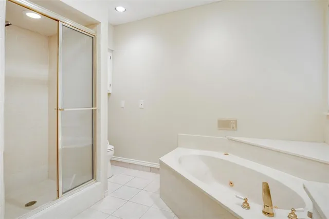 an empty room with closet and a chandelier fan