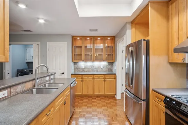 a view of a hallway with washer and dryer