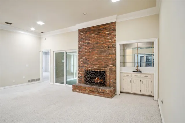 a room with wooden floor and furniture