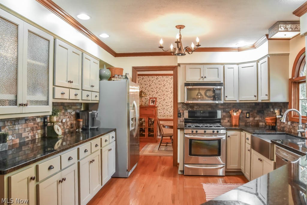 1741 Summerchase Road Northeast North Canton, OH 44721 - Photo 5 of 35 The kitchen has stainless steel appliances and hardwood floors.