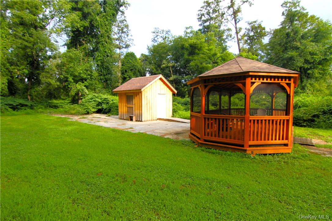 71 Miller Road, Unit 6 Hopewell Junction, NY 12533 - Photo 26 of 28 View of yard featuring a gazebo and a storage unit