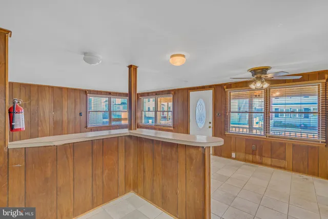 a view of a room with wooden walls