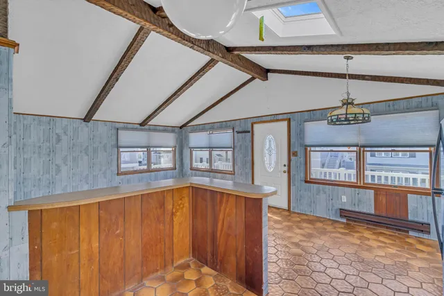 a bathroom with a glass shower door