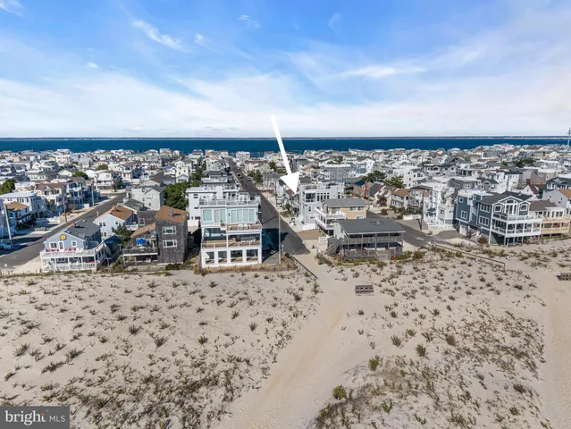 an aerial view of houses with outdoor space