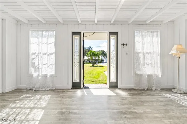 a view of a room with large windows