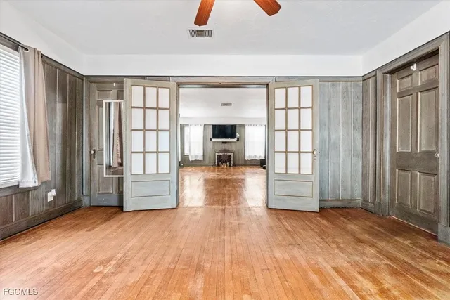 a view of livingroom with hardwood floor and a ceiling fan