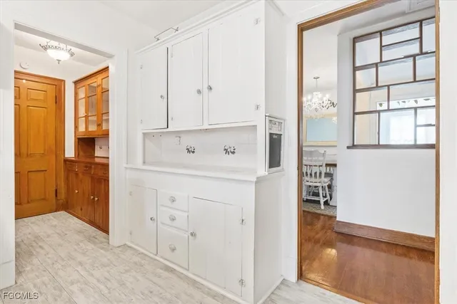 a view of cabinets with wooden floor
