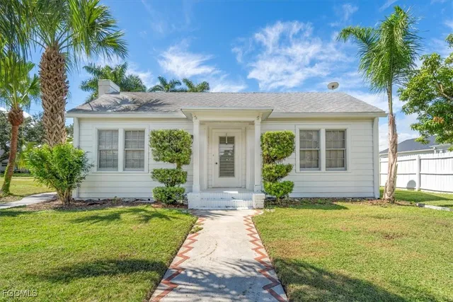 front view of a house with a yard