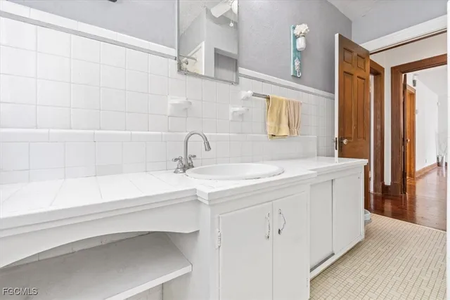 a bathroom with a sink and a mirror