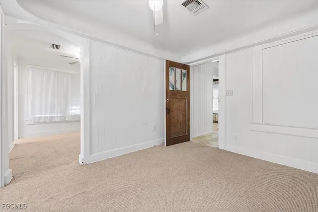 a view of an empty room and closet area