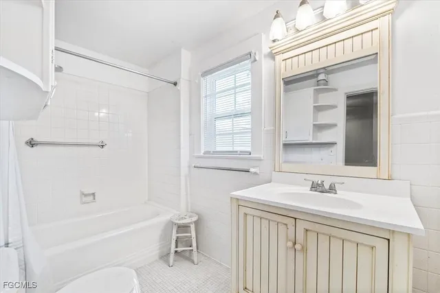 a bathroom with a sink a toilet and a bathtub