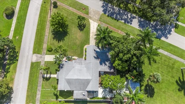 an aerial view of a house with a yard