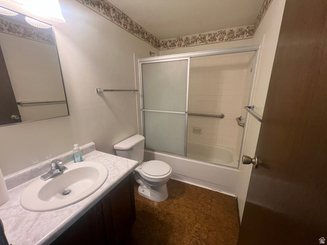 819 Castle Gate Circle Helper, UT 84526 - Photo 20 of 36 Full bathroom with vanity and shower / bath combination with glass door on the main floor