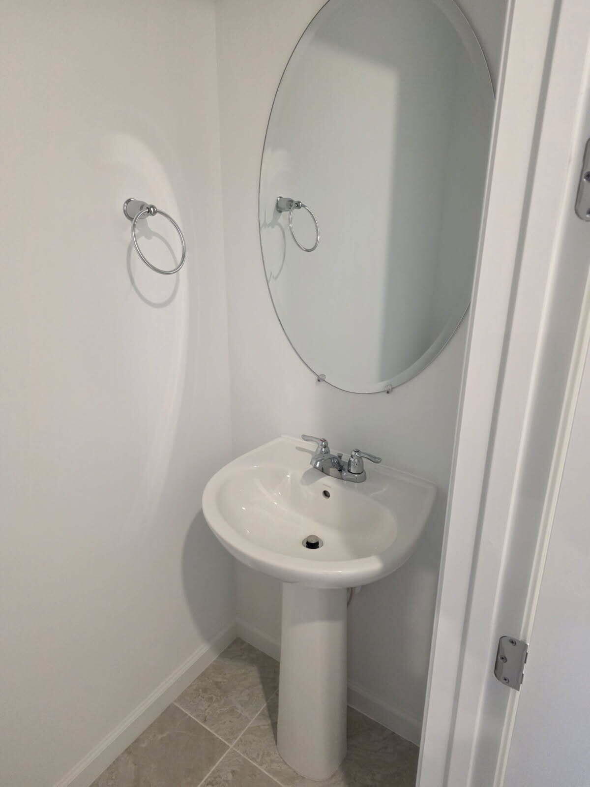 7783 Southwest Bentley Lane Stuart, FL 34997 - Photo 11 of 34 a bathroom with a sink a toilet and shower