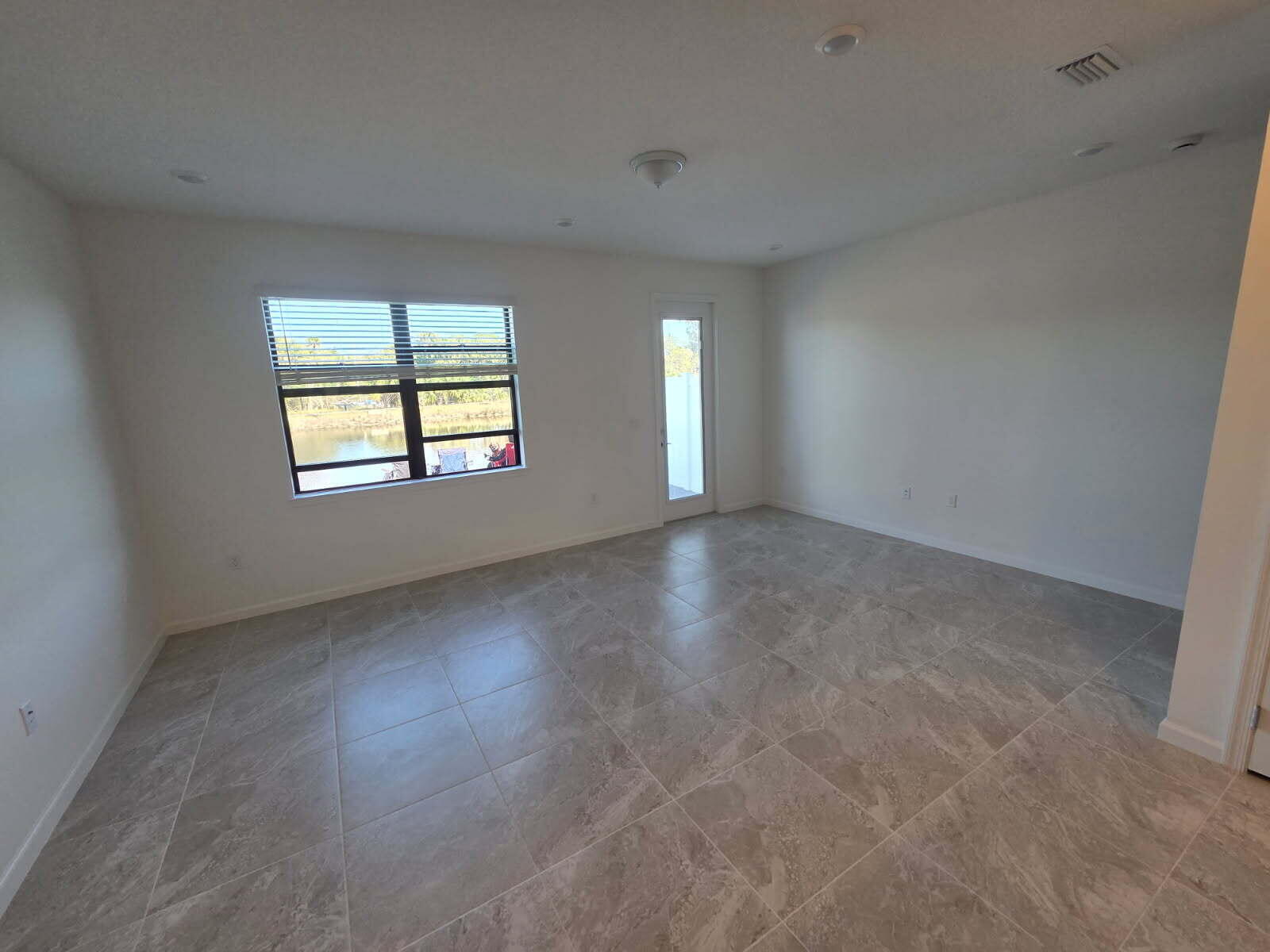 7783 Southwest Bentley Lane Stuart, FL 34997 - Photo 3 of 34 an empty room with windows