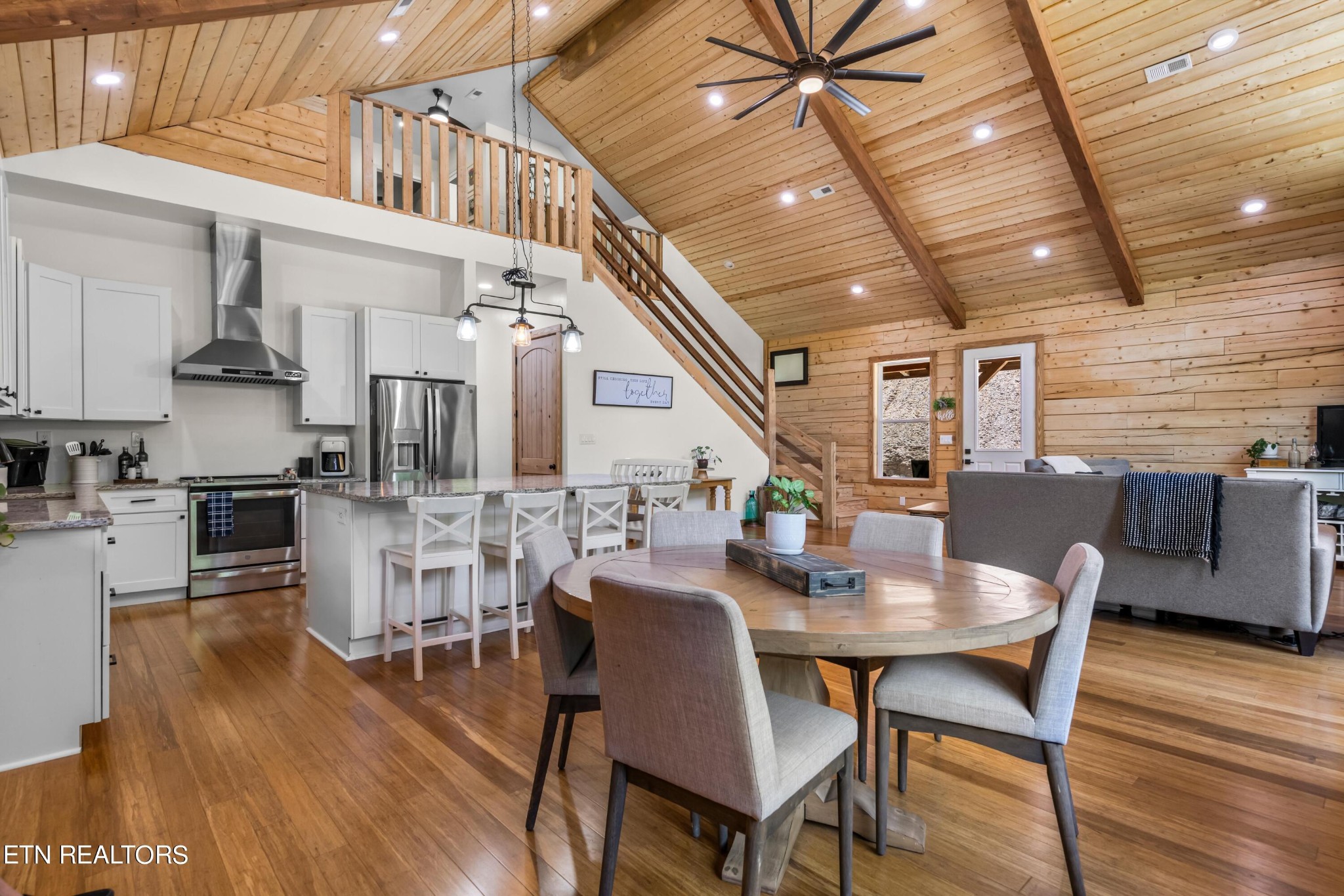 157 Foust Hollow Road Heiskell, TN 37754 - Photo 6 of 34 a dining room with furniture entryway and wooden floor