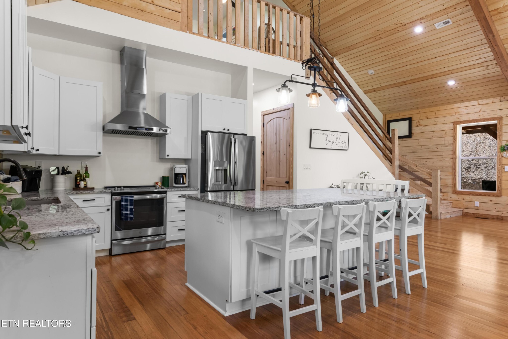 157 Foust Hollow Road Heiskell, TN 37754 - Photo 8 of 34 a kitchen with stainless steel appliances granite countertop a stove top oven a refrigerator a sink and dishwasher