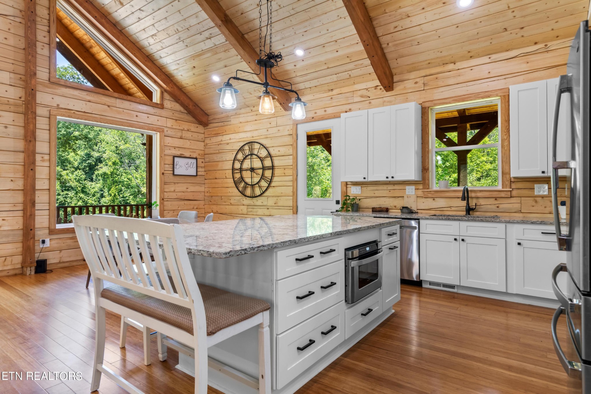 157 Foust Hollow Road Heiskell, TN 37754 - Photo 9 of 34 a kitchen with a window a sink and wooden floors