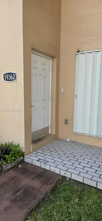 a view of a door with wooden fence