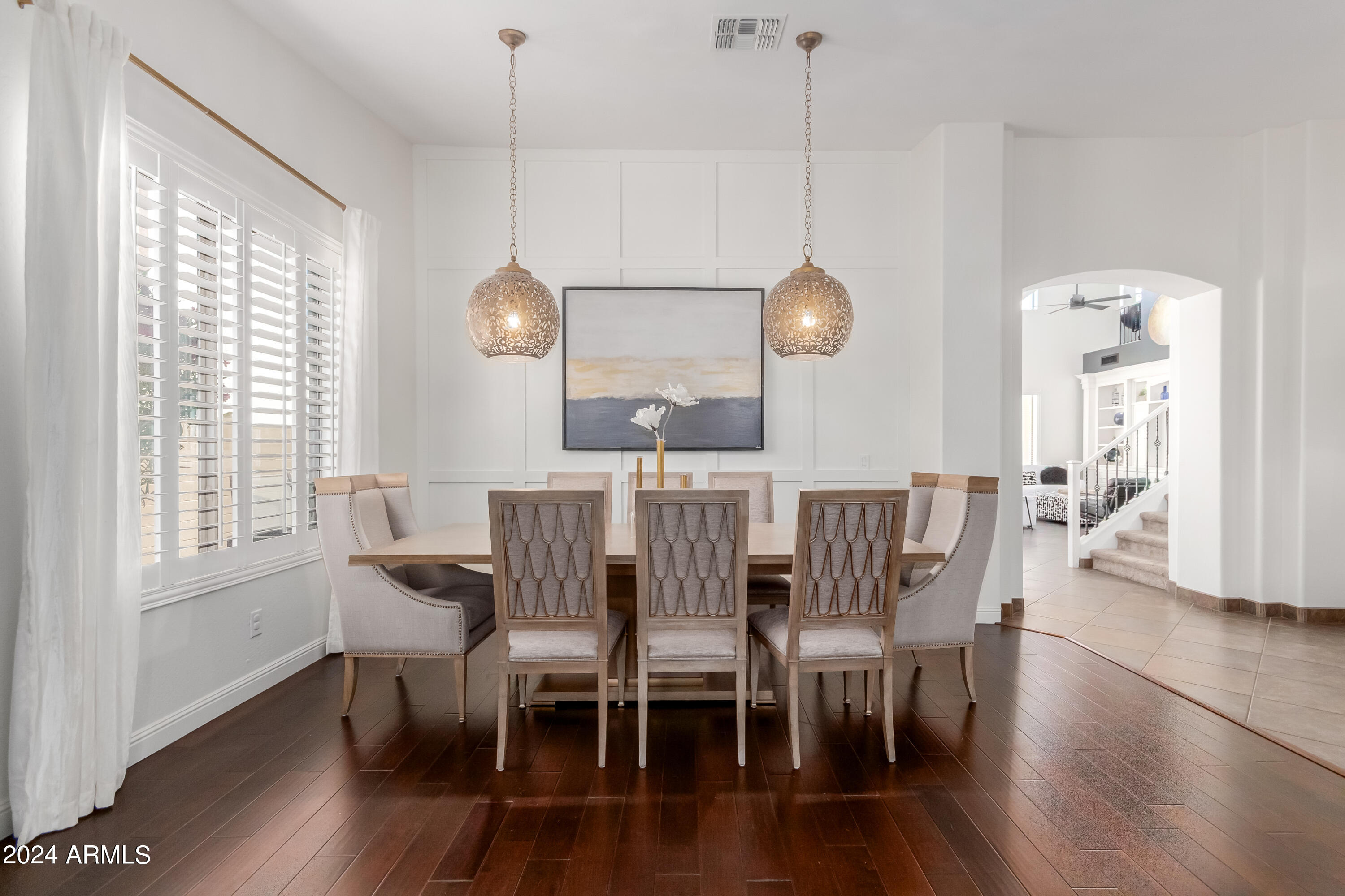 3272 East Blue Ridge Way Gilbert, AZ 85298 - Photo 9 of 47 a view of a dining room with furniture window and wooden floor
