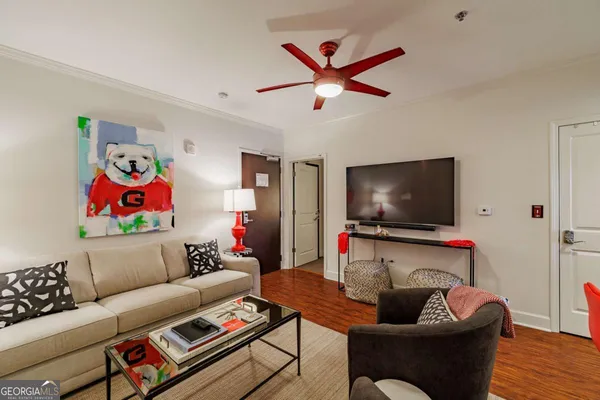 a living room with furniture and a flat screen tv