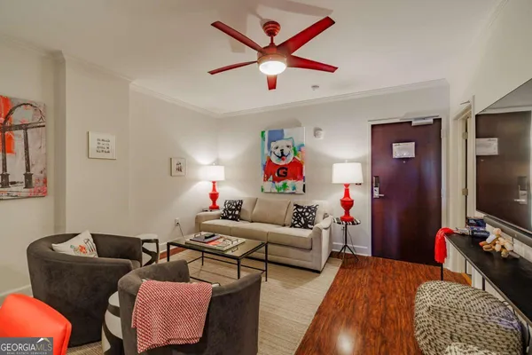 a living room with furniture and a flat screen tv