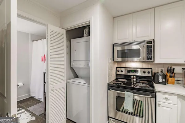 a kitchen with a stove and a microwave