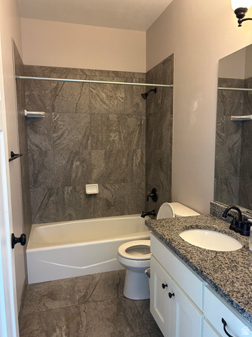 175 North 100th West Centerfield, UT 84622 - Photo 25 of 32 Full bathroom featuring a white vanity with a speckled countertop, integrated sink, and matte black faucet