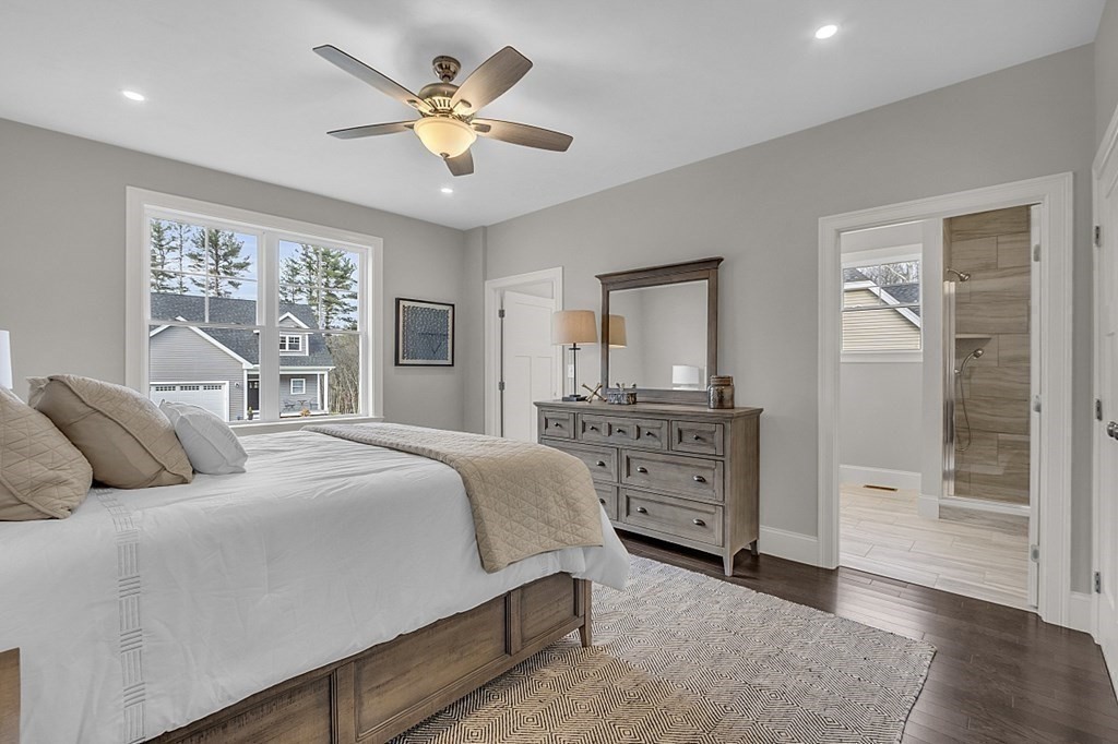 6 Shoemaker Lane, Unit 19 Upton, MA 01568 - Photo 17 of 30 a bedroom with a bed and a dresser