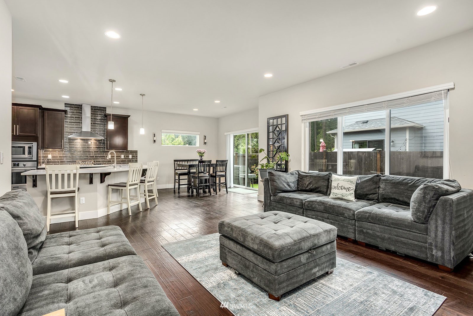 18005 44th Avenue Southeast Bothell, WA 98012 - Photo 12 of 30 a living room with furniture and a wooden floor