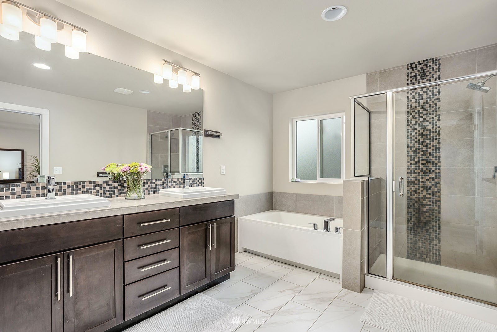 18005 44th Avenue Southeast Bothell, WA 98012 - Photo 18 of 30 a bathroom with a sink mirror and a bathtub