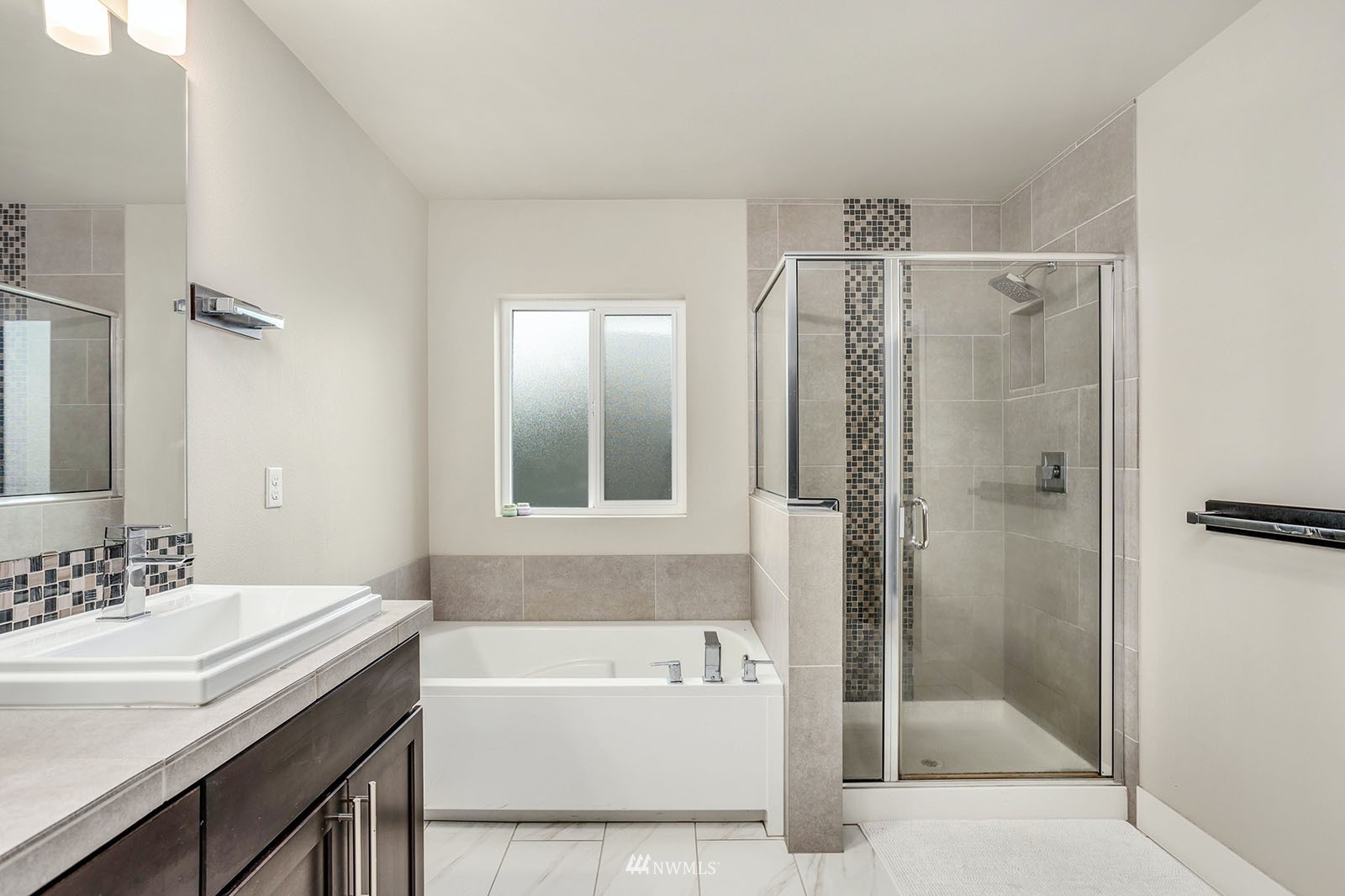 18005 44th Avenue Southeast Bothell, WA 98012 - Photo 19 of 30 a bathroom with a tub sink shower and mirror