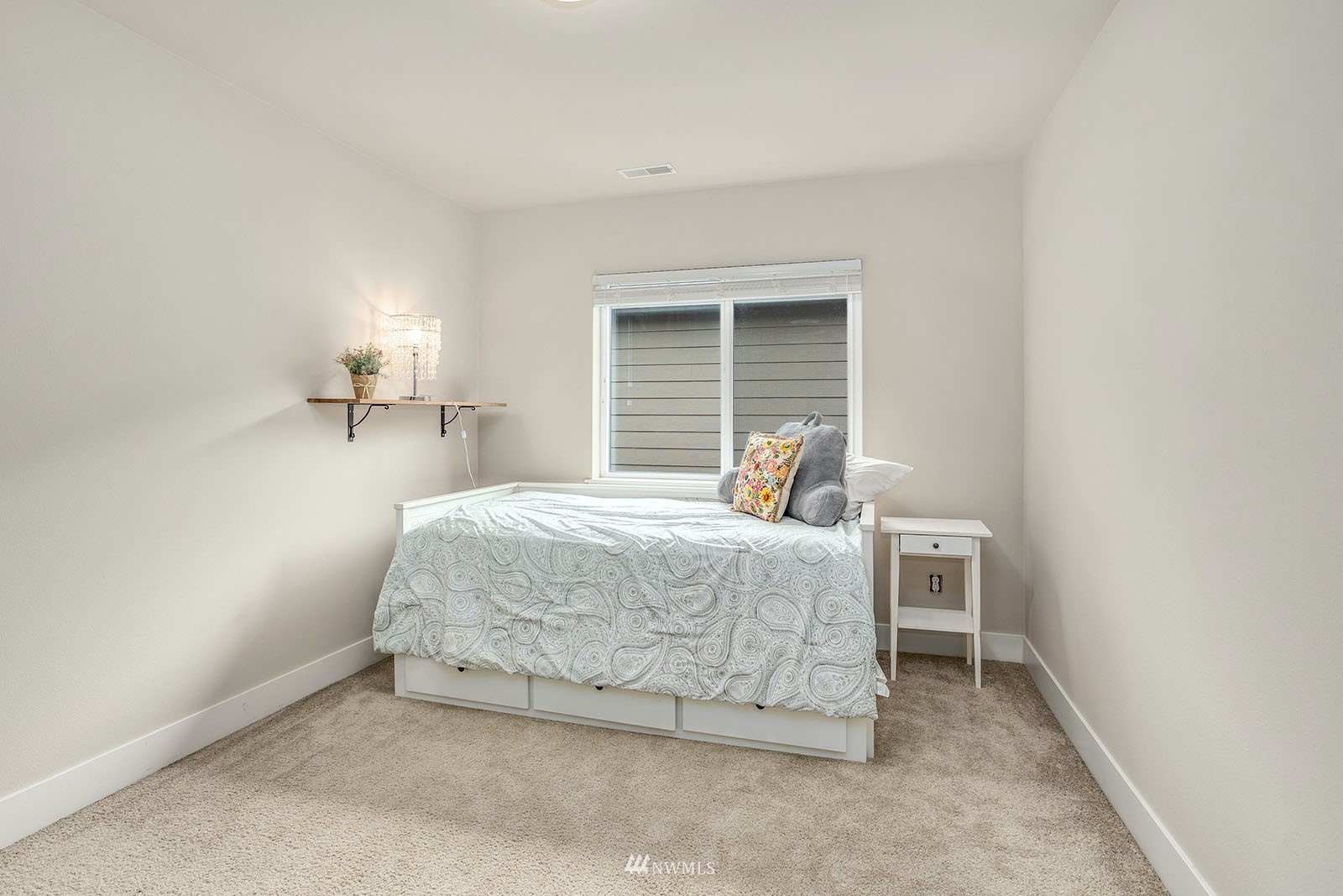 18005 44th Avenue Southeast Bothell, WA 98012 - Photo 23 of 30 a bedroom with a bed and a window