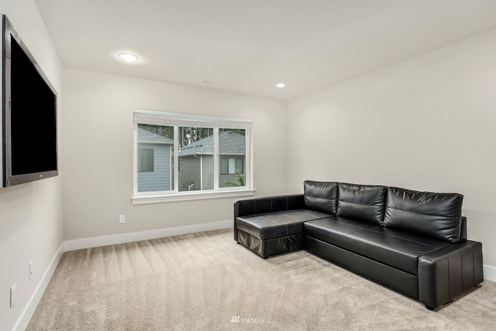 18005 44th Avenue Southeast Bothell, WA 98012 - Photo 25 of 30 a living room with furniture and a flat screen tv