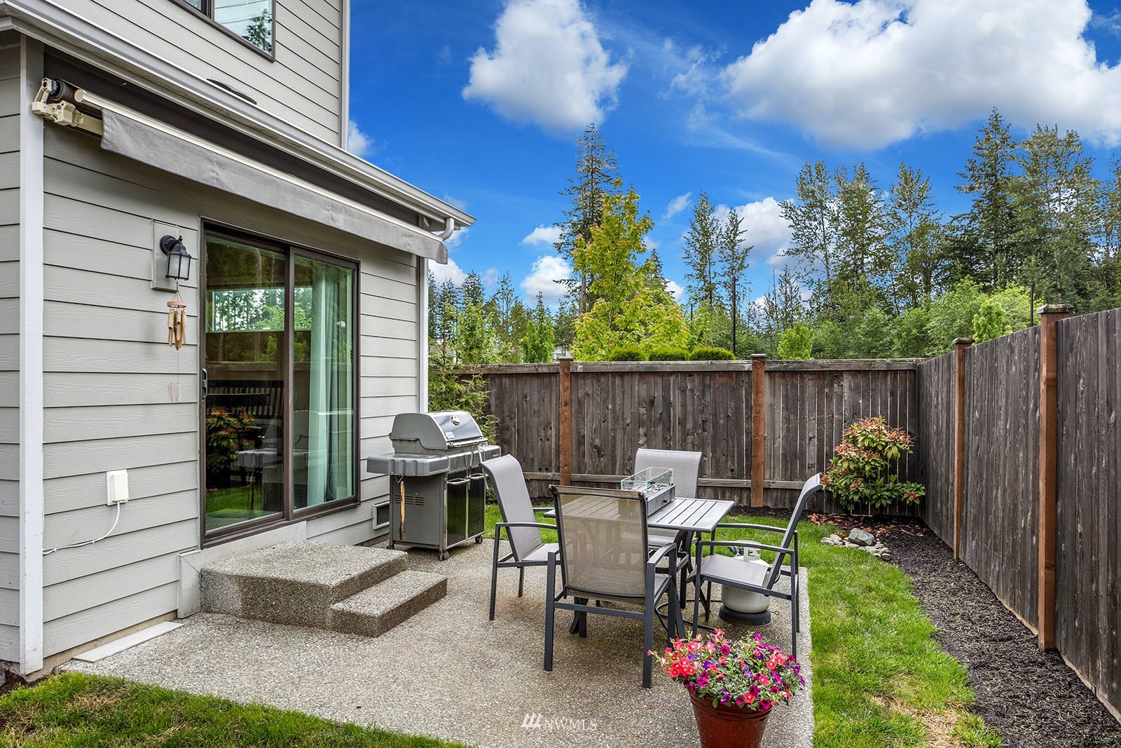 18005 44th Avenue Southeast Bothell, WA 98012 - Photo 28 of 30 a view of a chairs and table in backyard of the house