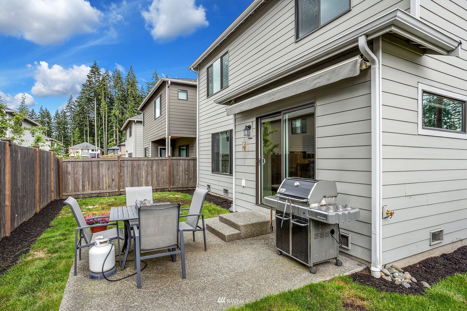 18005 44th Avenue Southeast Bothell, WA 98012 - Photo 29 of 30 a view of a patio with a table and chairs