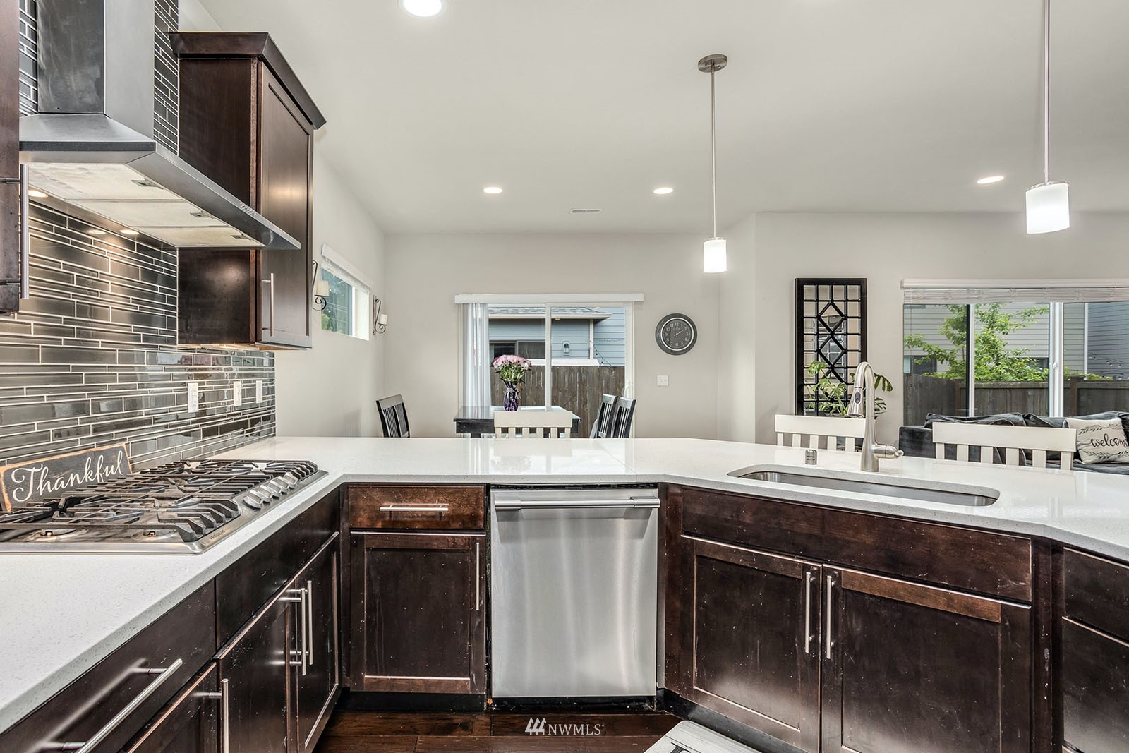 18005 44th Avenue Southeast Bothell, WA 98012 - Photo 7 of 30 a kitchen with a sink stove and cabinets