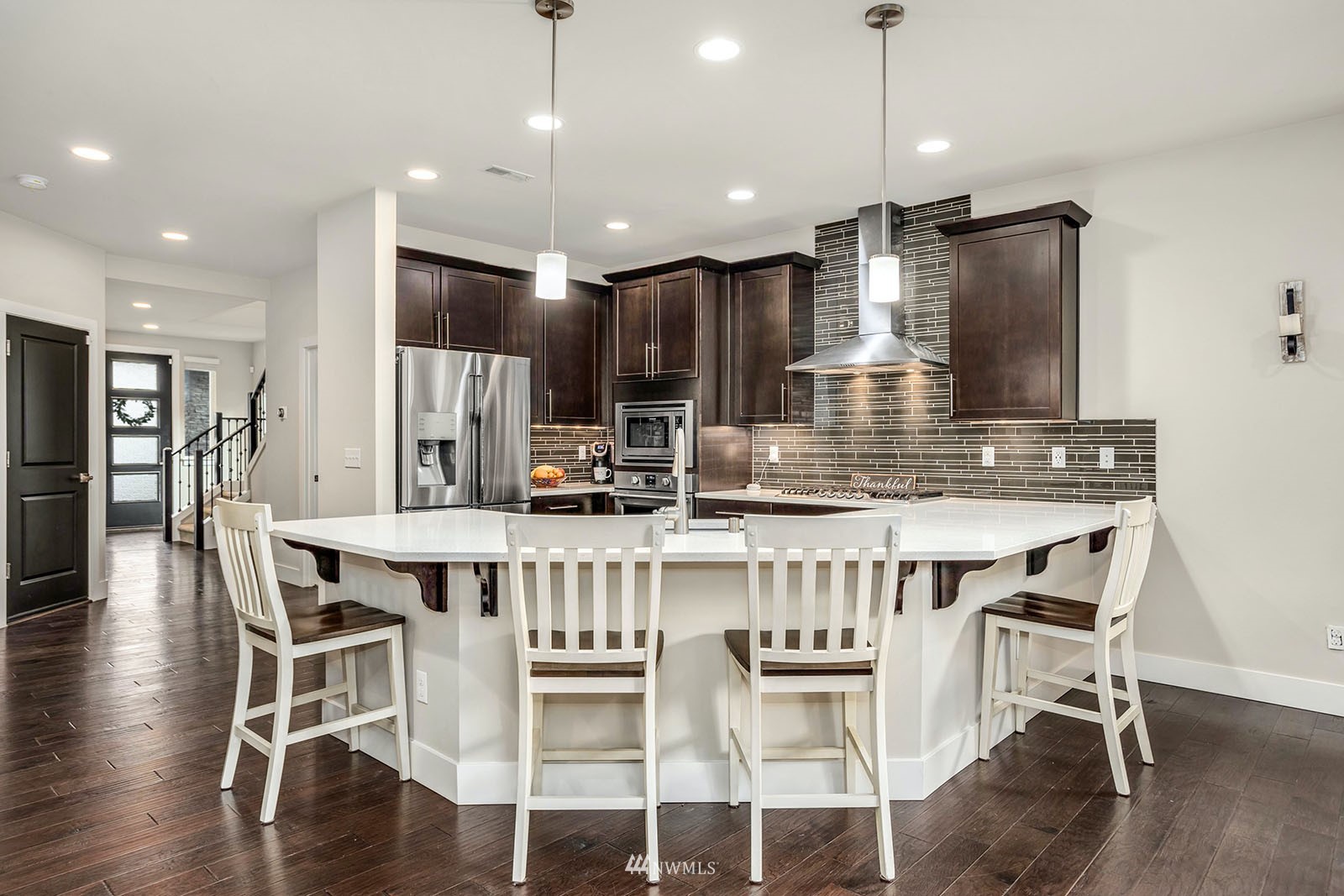 18005 44th Avenue Southeast Bothell, WA 98012 - Photo 8 of 30 a kitchen with a table and chairs in it