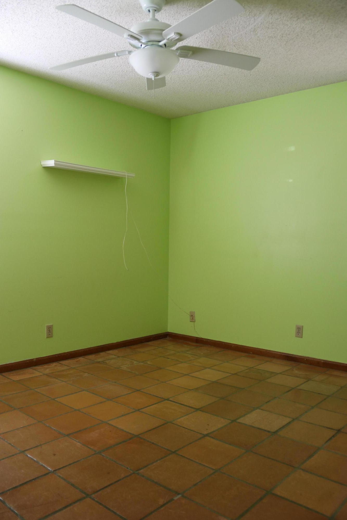 6098 Kendrick Street Jupiter, FL 33458 - Photo 4 of 15 an empty room with a ceiling fan and carpet