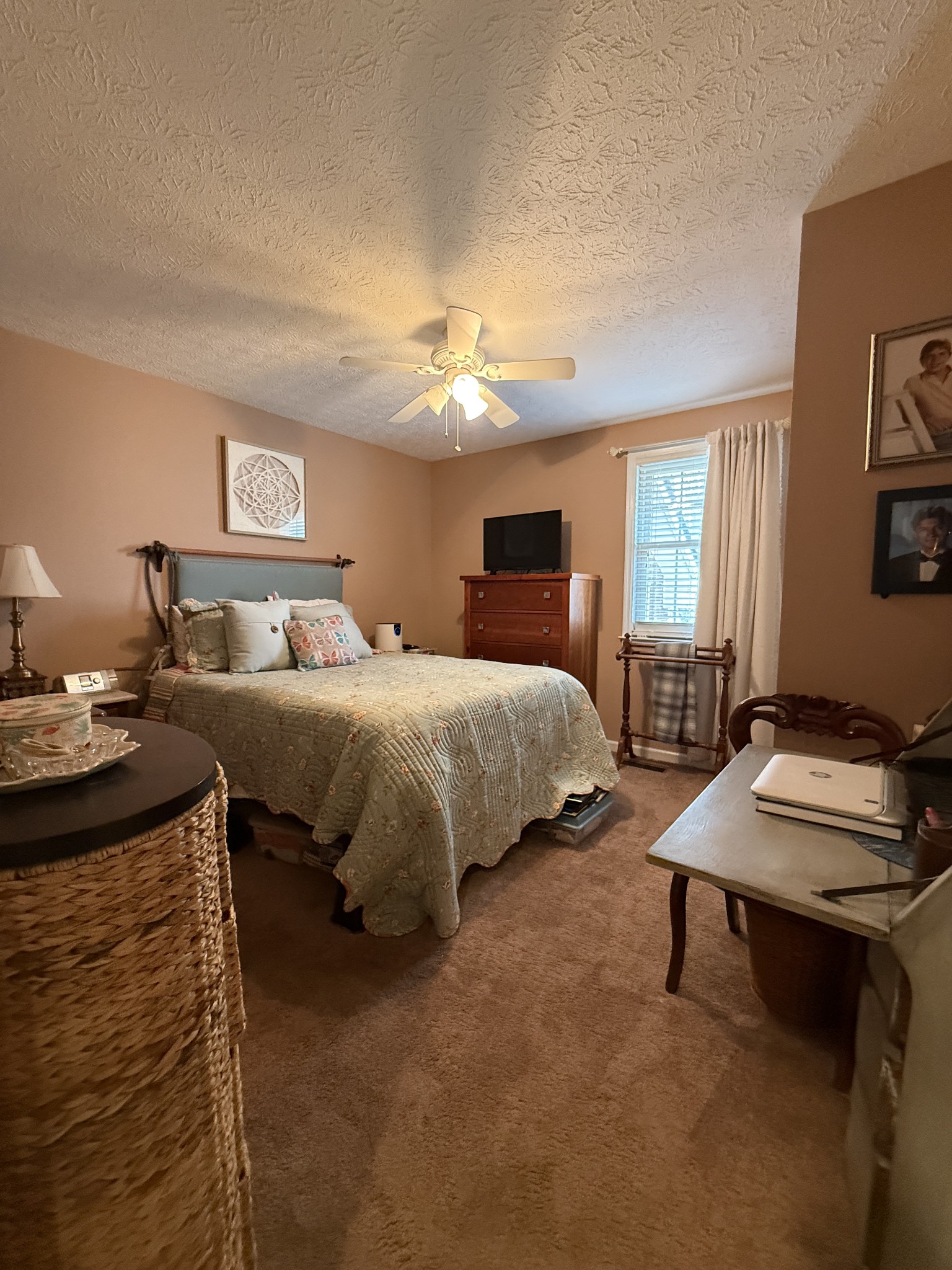 2115 Mockingbird Lane, Unit A Springfield, TN 37172 - Photo 8 of 12 a bedroom with bed a table and painting on the wall