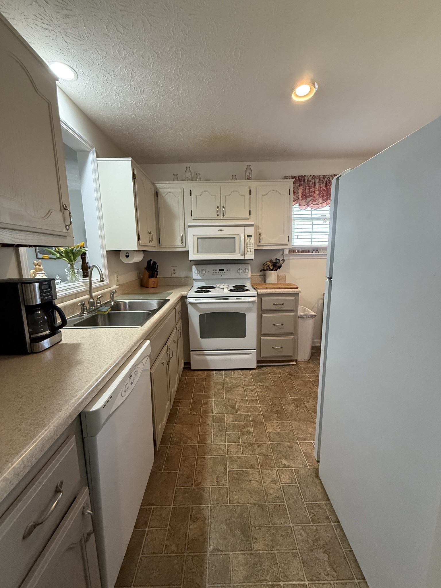 2115 Mockingbird Lane, Unit A Springfield, TN 37172 - Photo 9 of 12 a kitchen with cabinets a sink and appliances