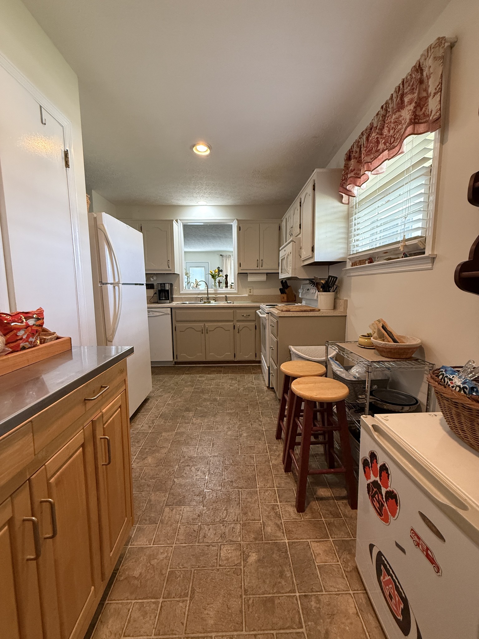 2115 Mockingbird Lane, Unit A Springfield, TN 37172 - Photo 10 of 12 a kitchen with a refrigerator and a stove top oven