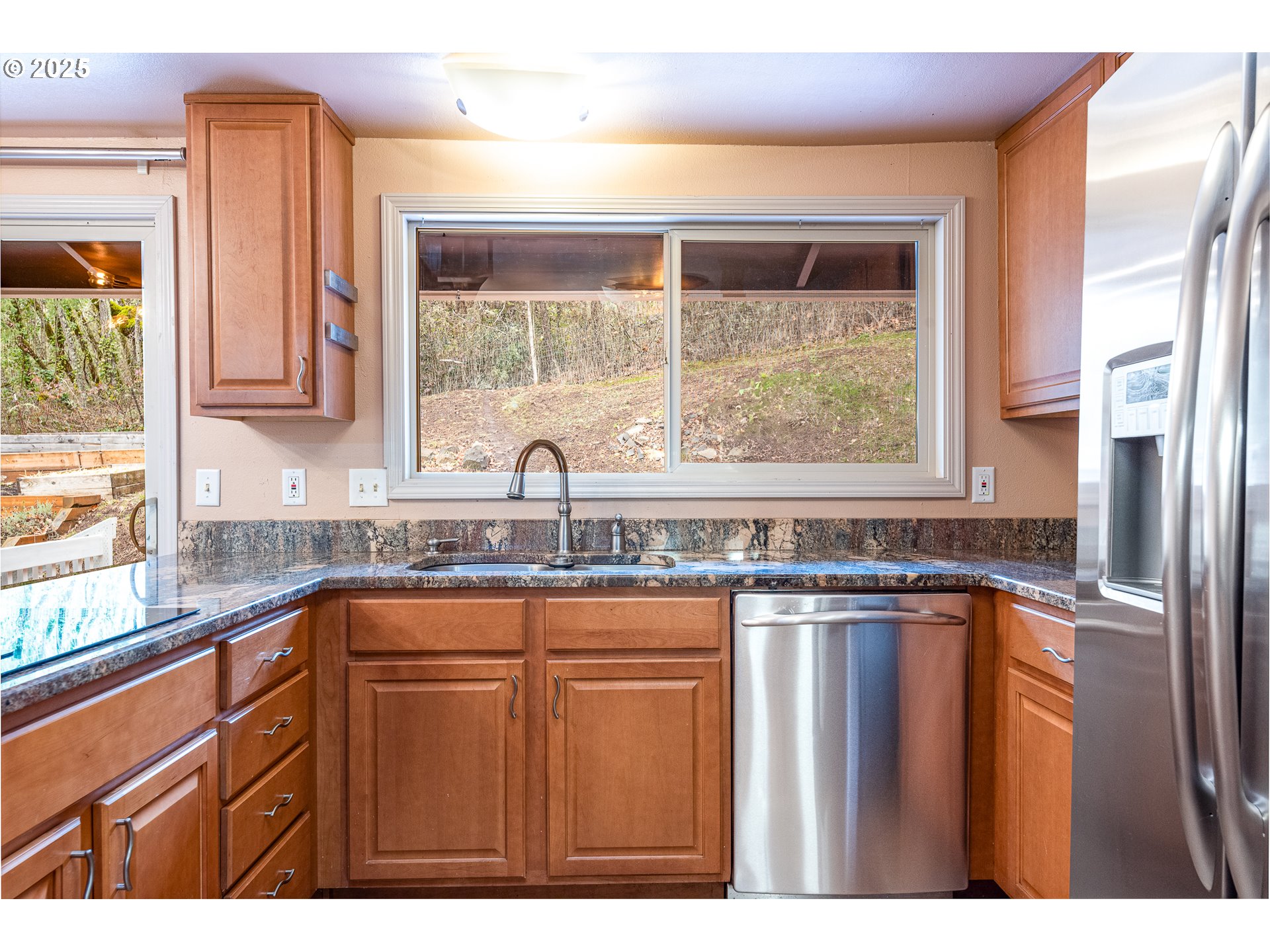 293 Brae Burn Drive Eugene, OR 97405 - Photo 12 of 35 a kitchen with granite countertop a window and a sink