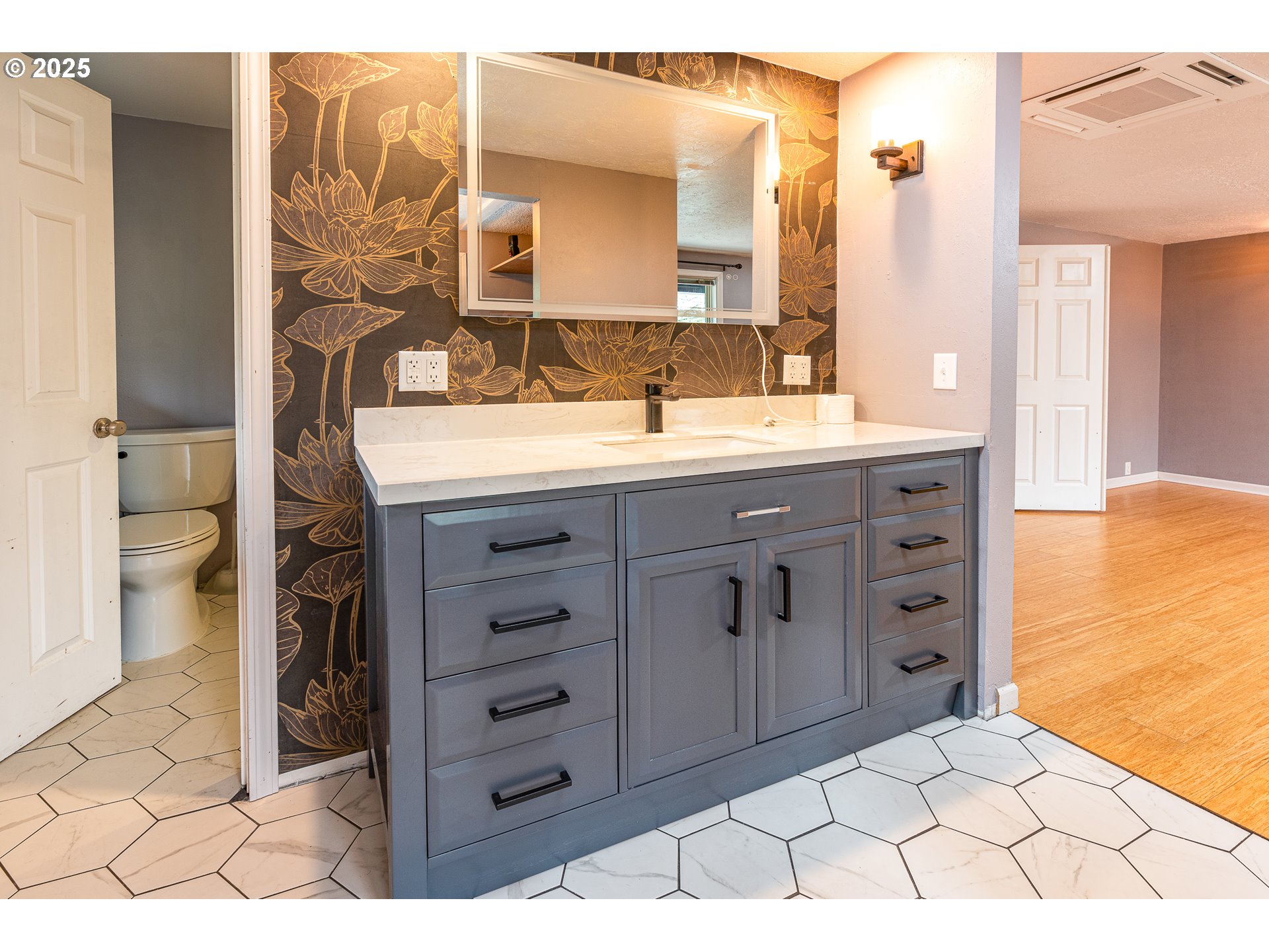 293 Brae Burn Drive Eugene, OR 97405 - Photo 17 of 35 a bathroom with a granite countertop sink a toilet and a mirror