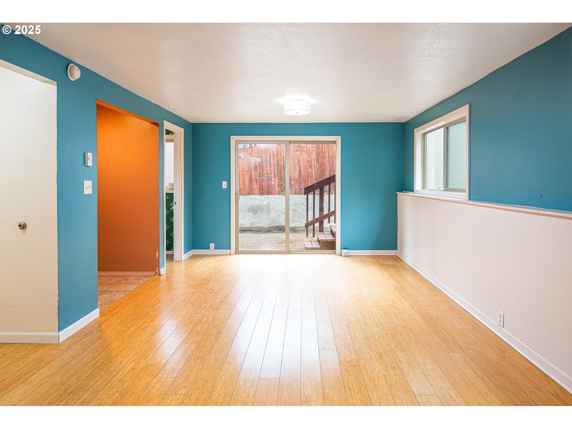 293 Brae Burn Drive Eugene, OR 97405 - Photo 27 of 35 a view of an empty room with wooden floor and a window